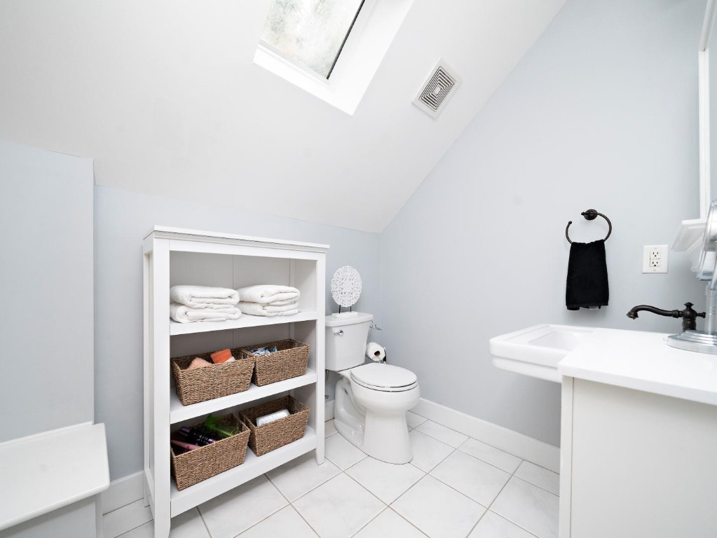 2516 Mt Vernon Church Road Raleigh, NC 27614 - Photo 38 of 58 a bathroom with a toilet a sink and a mirror