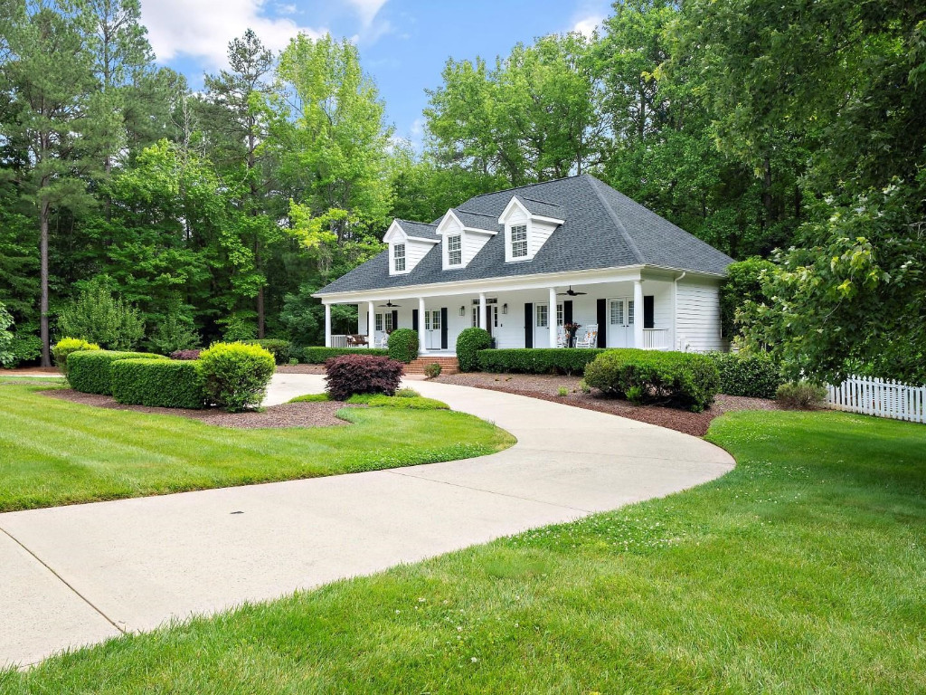 2516 Mt Vernon Church Road Raleigh, NC 27614 - Photo 4 of 58 a front view of a house with a yard