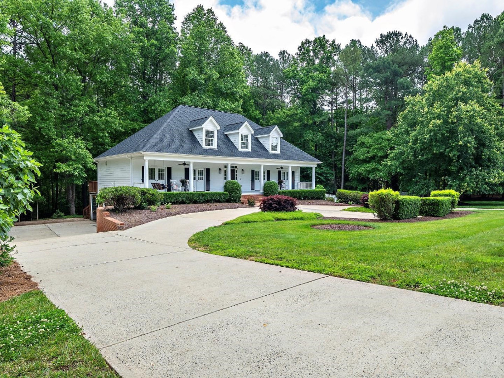 2516 Mt Vernon Church Road Raleigh, NC 27614 - Photo 5 of 58 a front view of a house with a yard