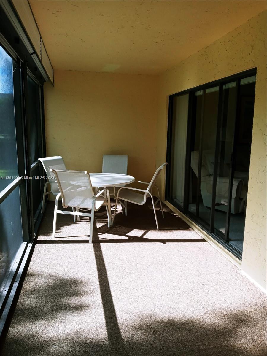 1081 Keystone Drive, Unit A Jupiter, FL 33458 - Photo 2 of 10 a view of a balcony with chairs