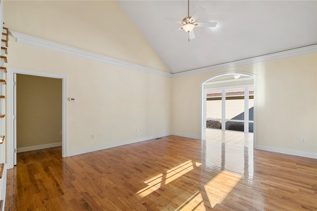 16 Oleander Drive Anderson, SC 29621 - Photo 7 of 37 Hardwood flooring and a vaulted ceiling elevate this inviting living space.