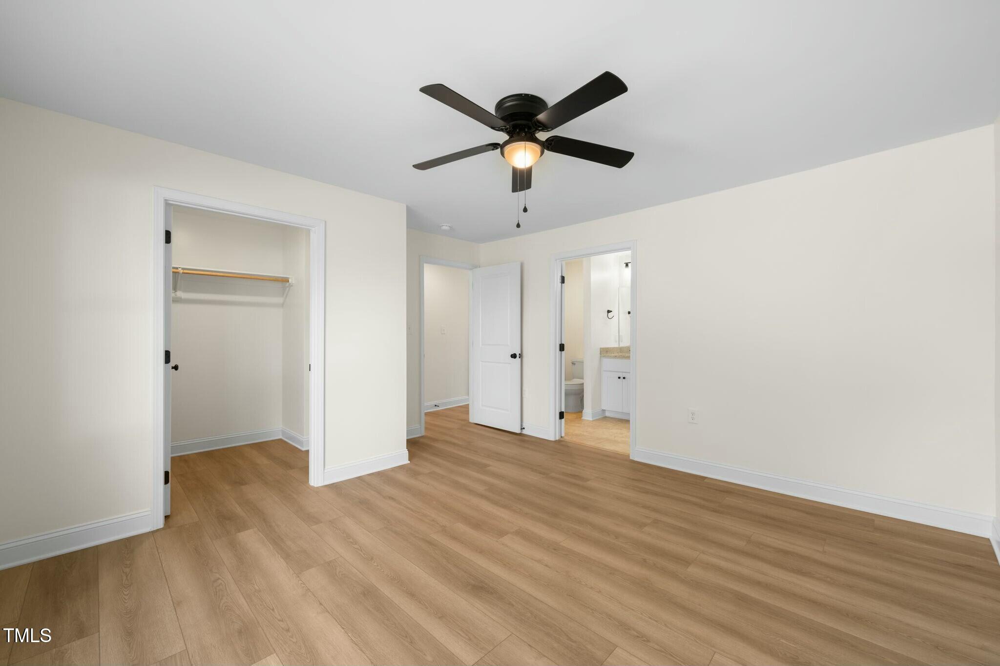 8917 Fowler Road Zebulon, NC 27597 - Photo 17 of 33 a view of an empty room with wooden floor