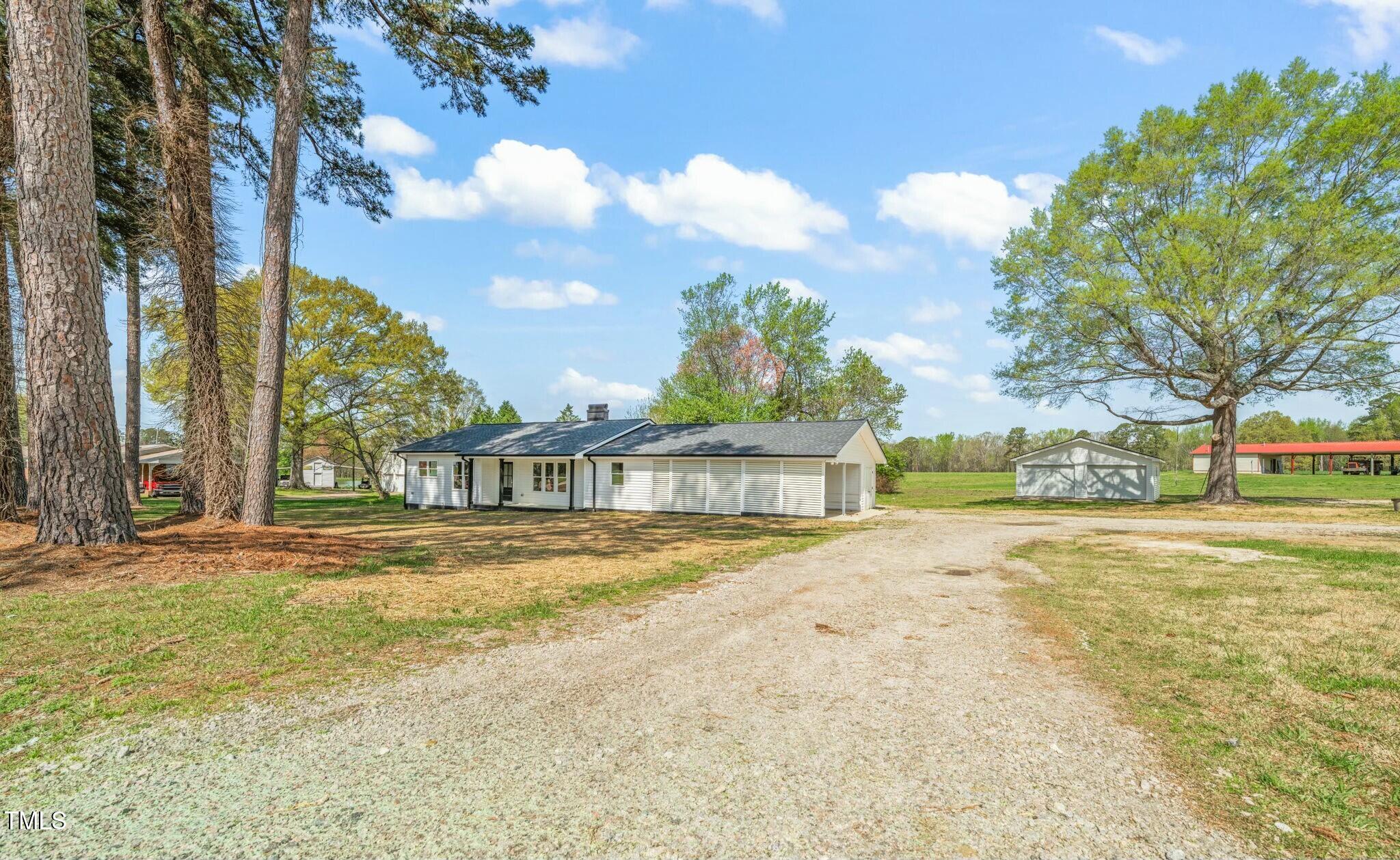 8917 Fowler Road Zebulon, NC 27597 - Photo 2 of 33 a view of large yard with large trees