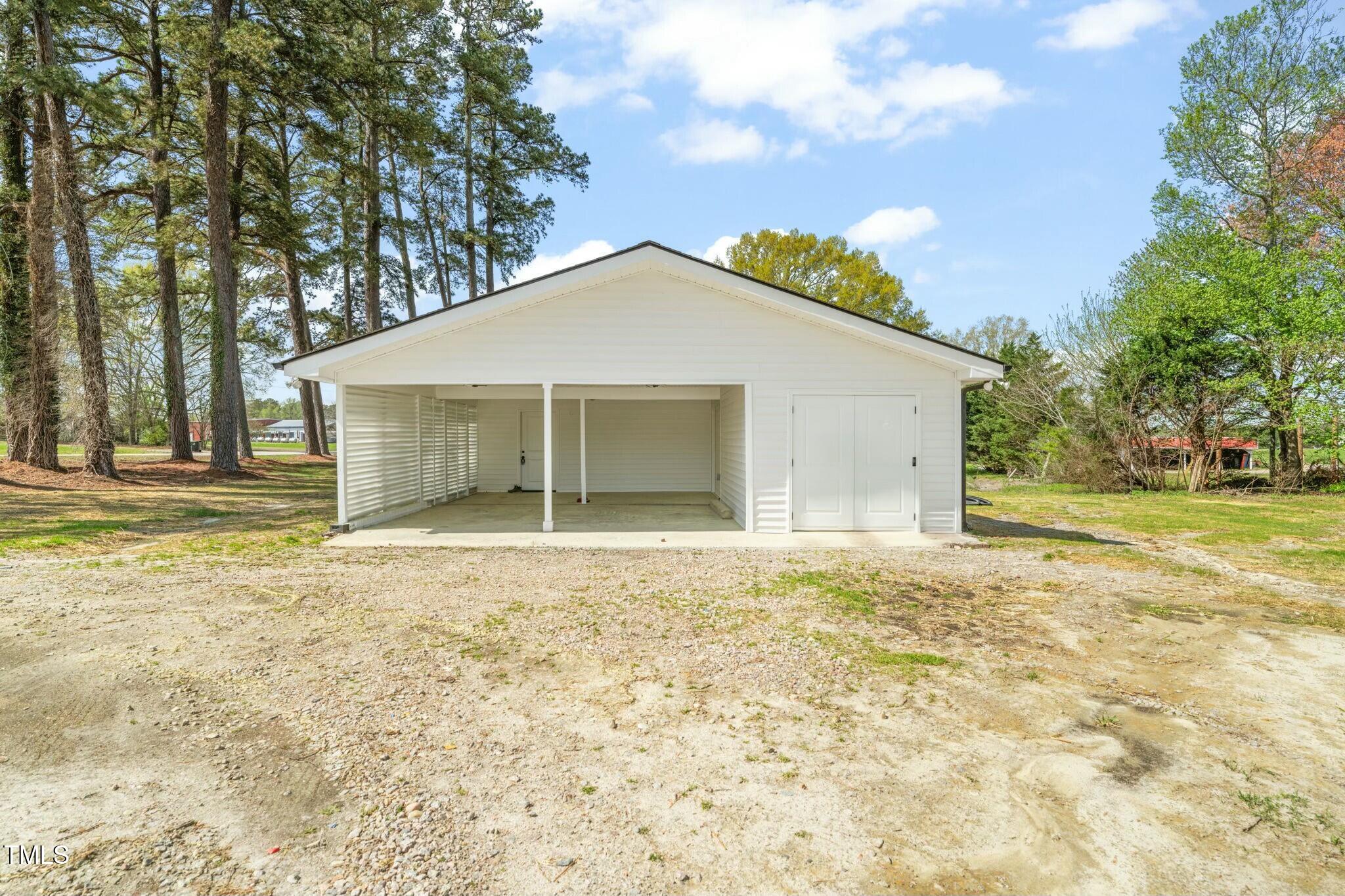8917 Fowler Road Zebulon, NC 27597 - Photo 4 of 33 front view of a house with a yard