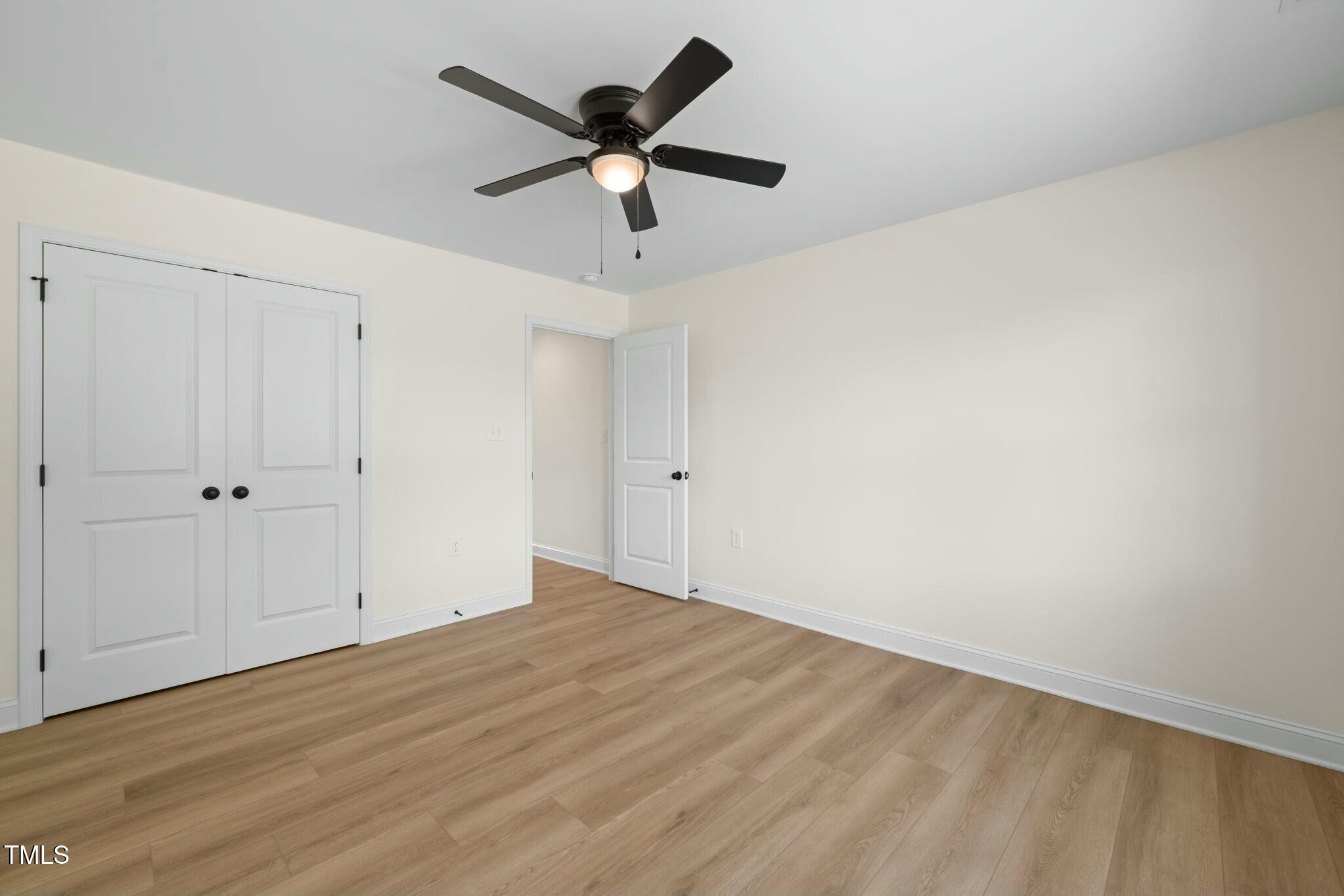 8917 Fowler Road Zebulon, NC 27597 - Photo 8 of 33 wooden floor in an empty room