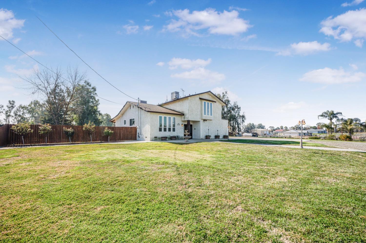 31334 Donald Avenue Madera, CA 93636 - Photo 33 of 38 a house view with swimming pool in front of it
