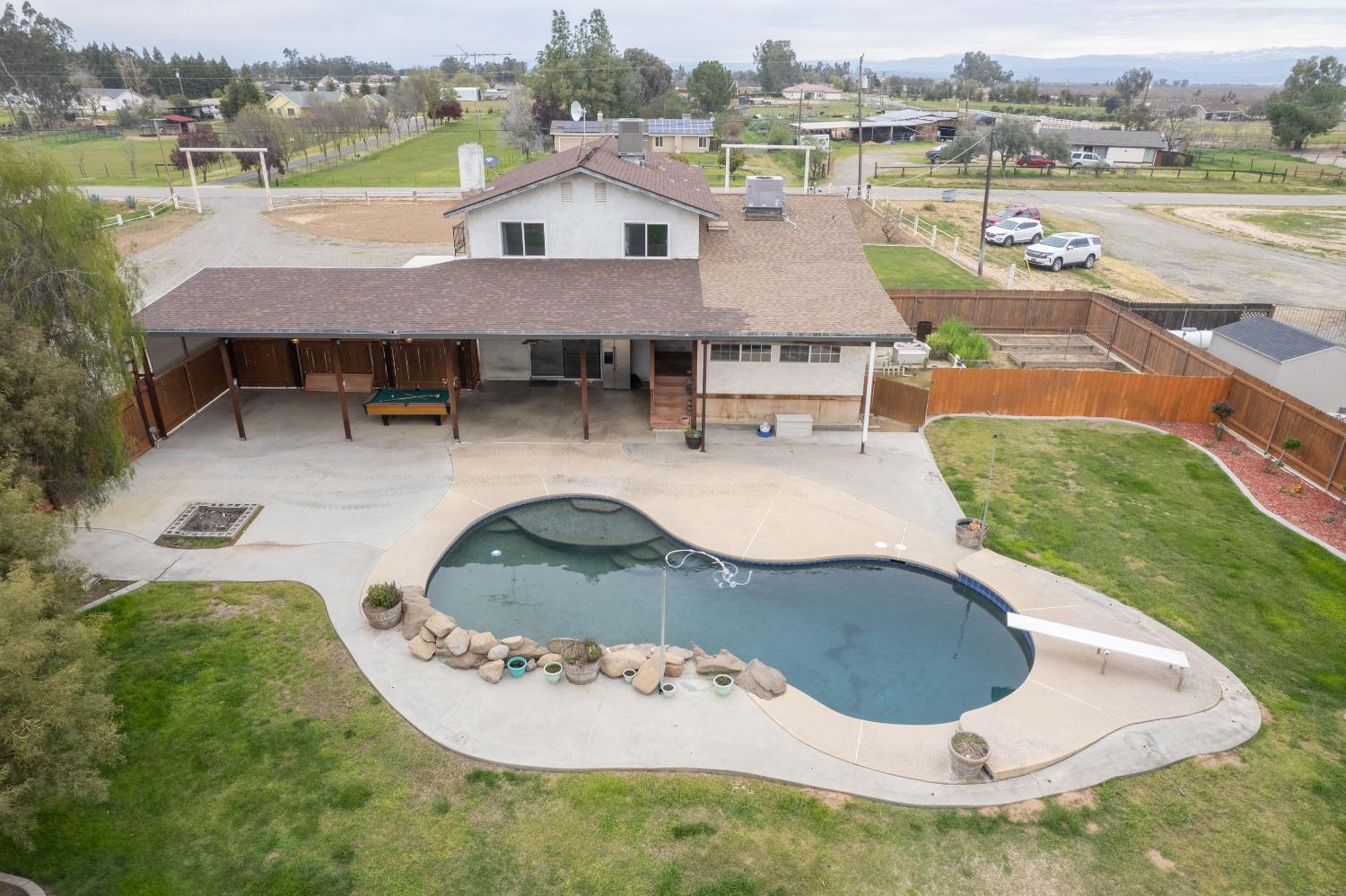 31334 Donald Avenue Madera, CA 93636 - Photo 36 of 38 an aerial view of a house with outdoor space and lake view