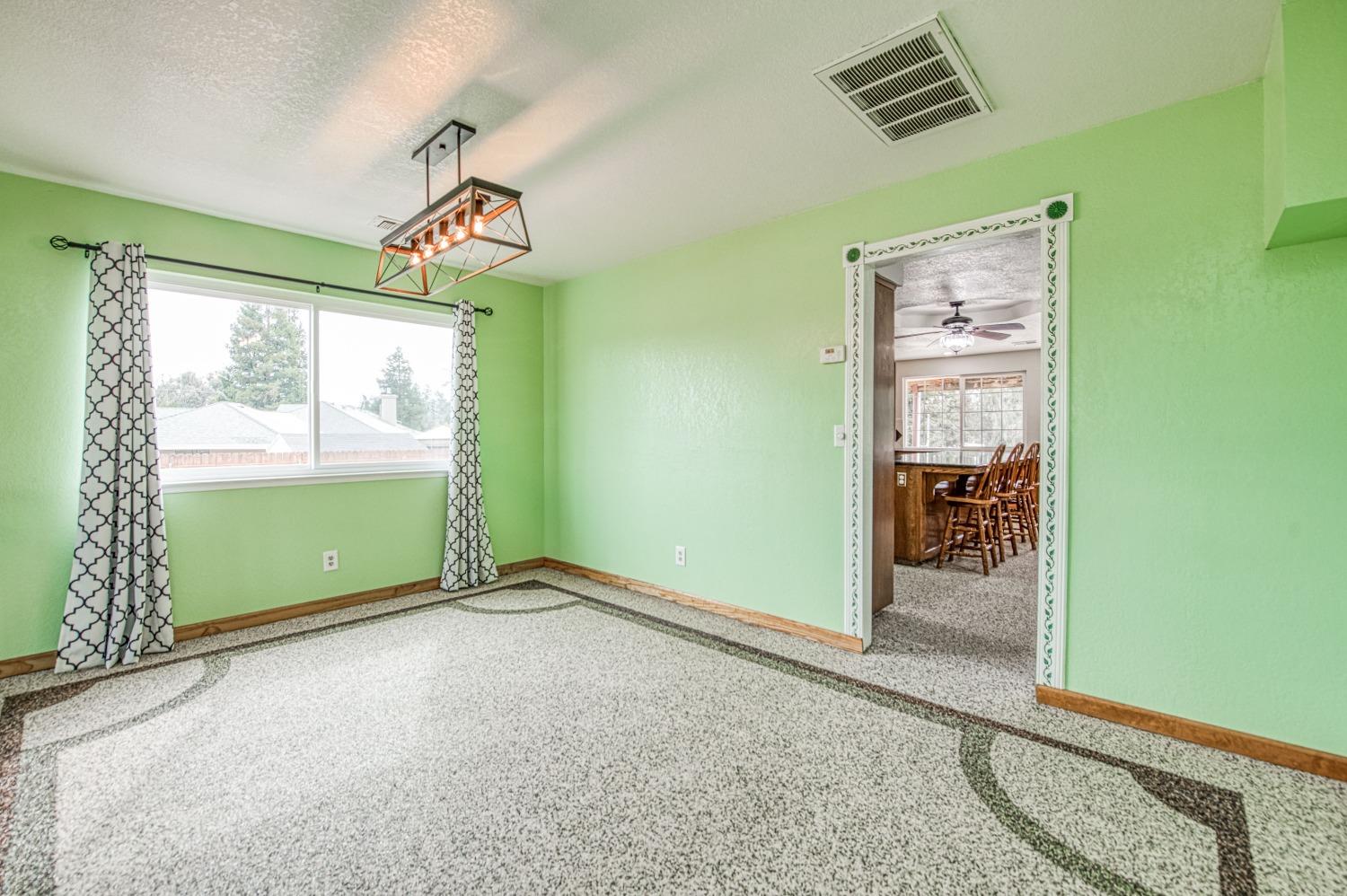 31334 Donald Avenue Madera, CA 93636 - Photo 5 of 38 an empty room with windows