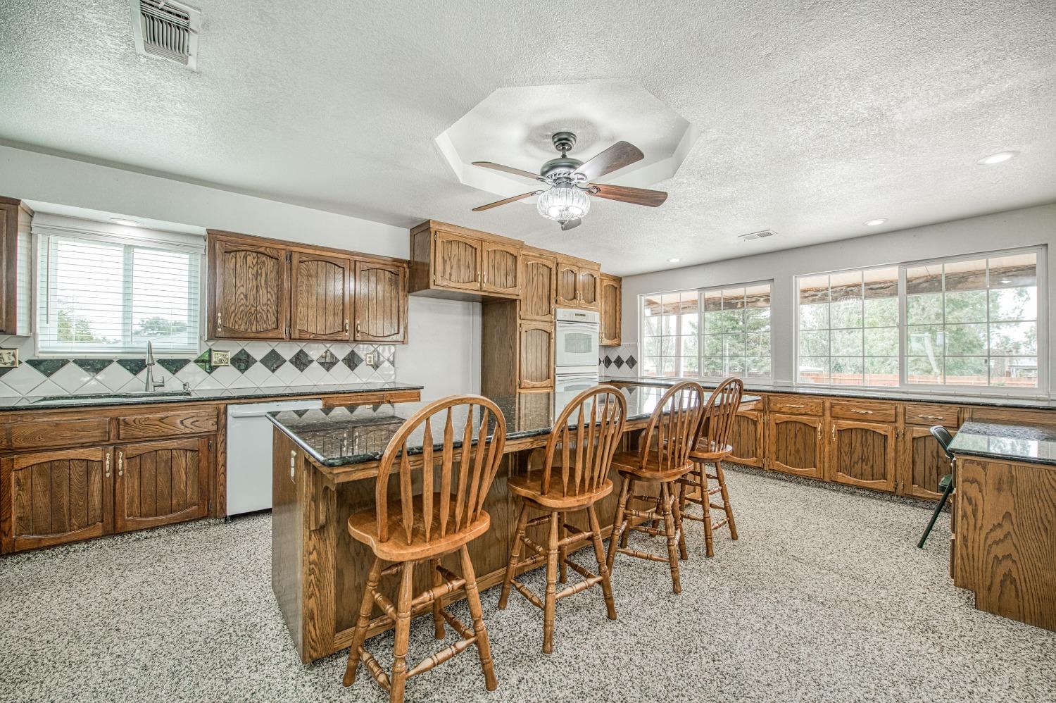 31334 Donald Avenue Madera, CA 93636 - Photo 8 of 38 a view of a dining room with furniture window and outside view