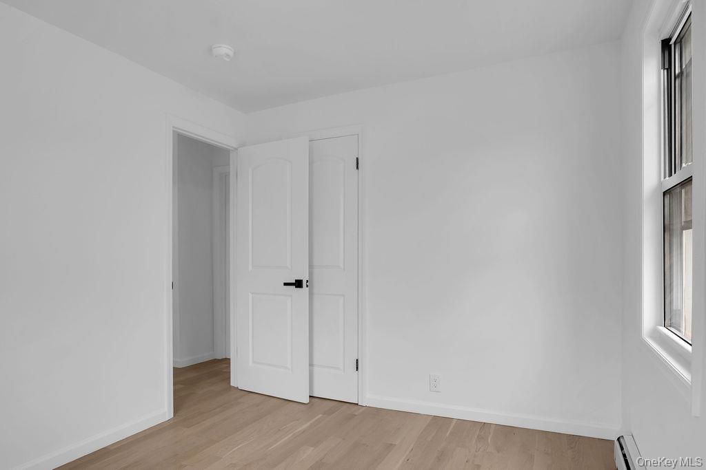 173-62 103rd Road Queens, NY 11433 - Photo 9 of 23 a view of an empty room