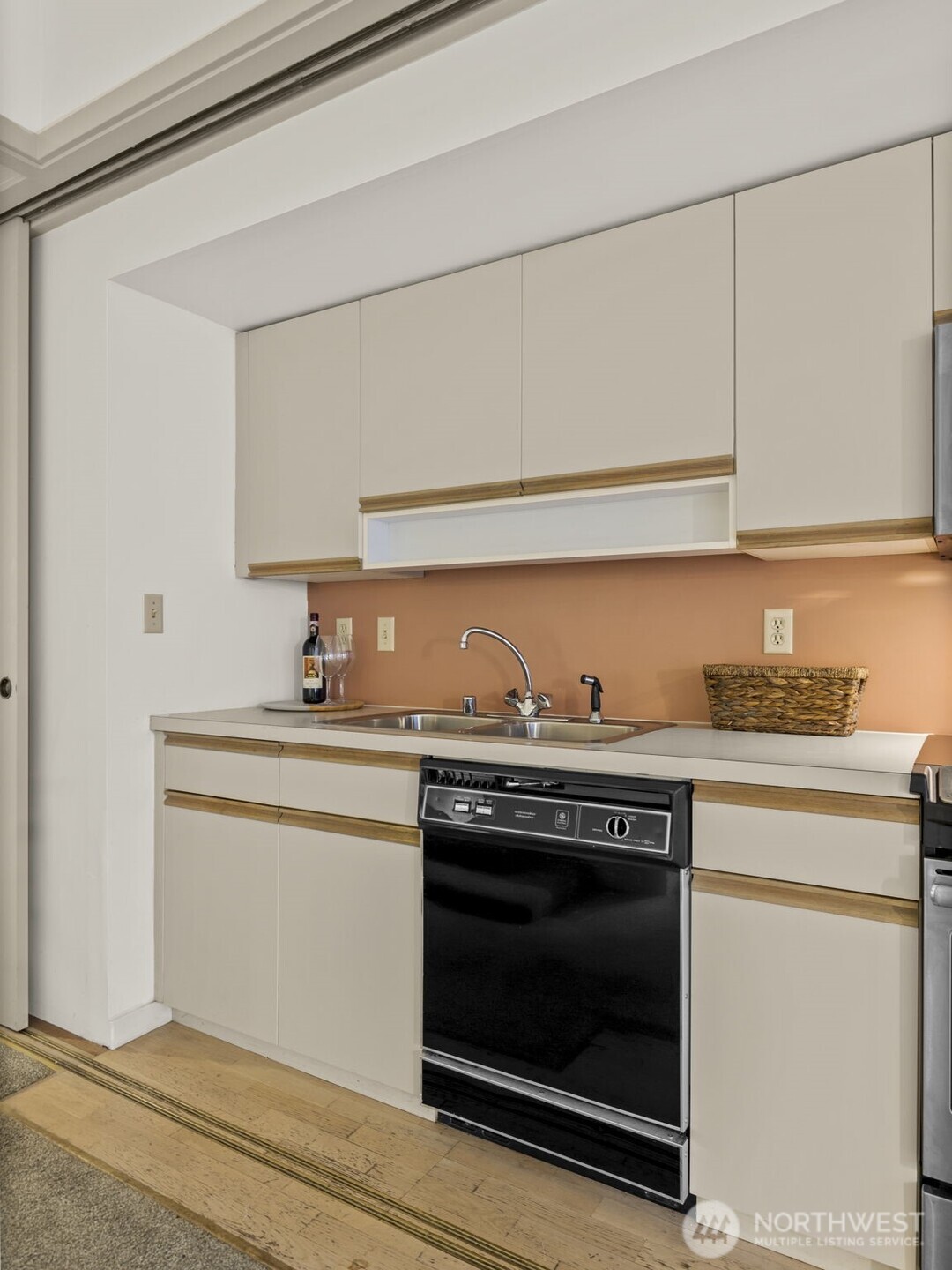98 Union Street, Unit 610 Seattle, WA 98101 - Photo 13 of 33 a kitchen with granite countertop a stove and a sink
