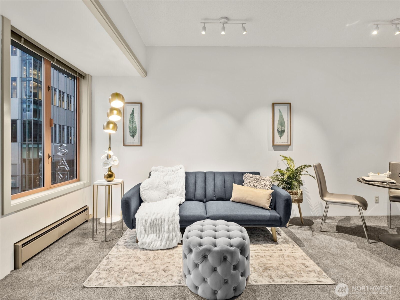 98 Union Street, Unit 610 Seattle, WA 98101 - Photo 19 of 33 a living room with furniture and a window