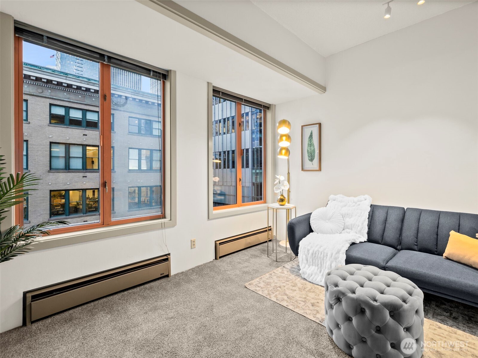 98 Union Street, Unit 610 Seattle, WA 98101 - Photo 20 of 33 a living room with furniture and a window