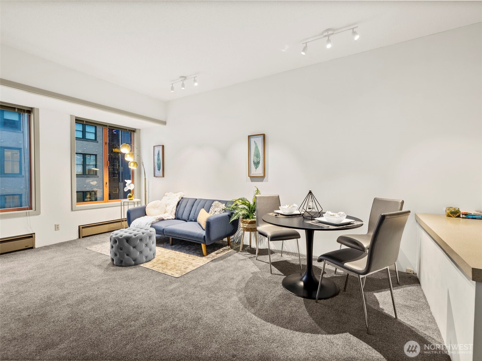 98 Union Street, Unit 610 Seattle, WA 98101 - Photo 23 of 33 a living room with furniture and floor to ceiling windows
