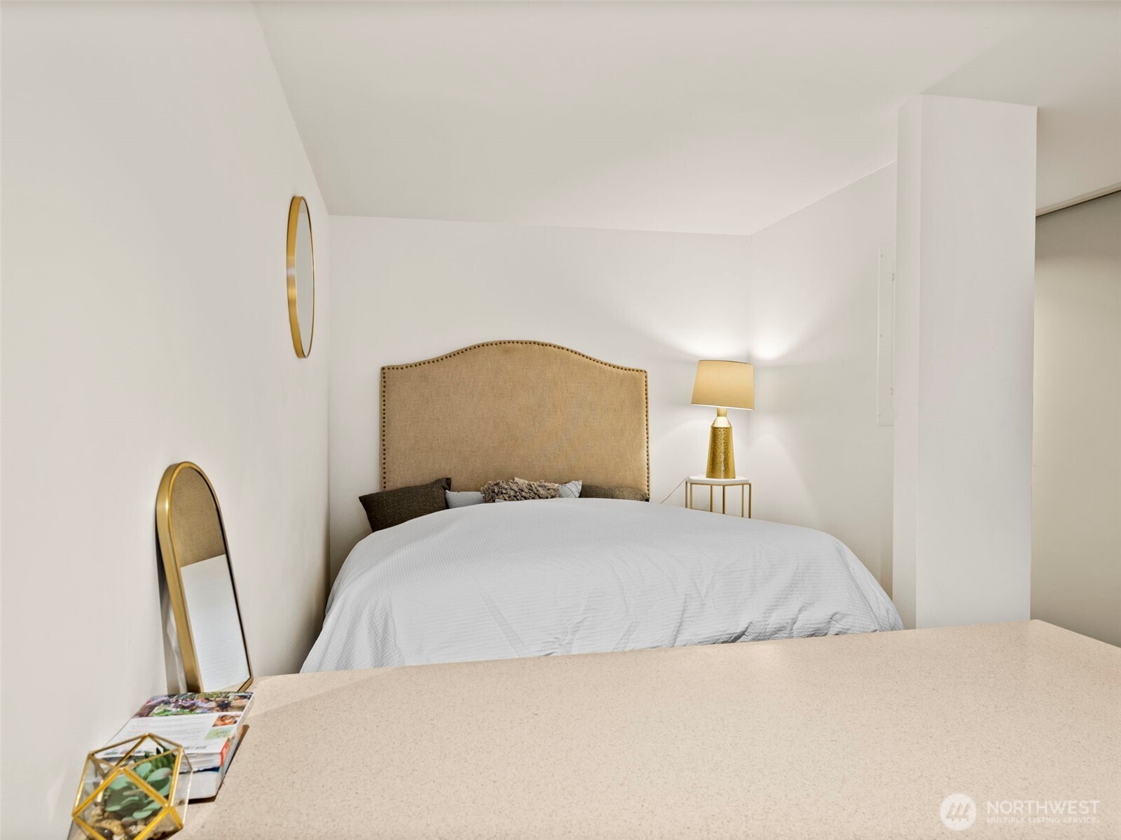 98 Union Street, Unit 610 Seattle, WA 98101 - Photo 26 of 33 a bedroom with a bed and a painting on the wall