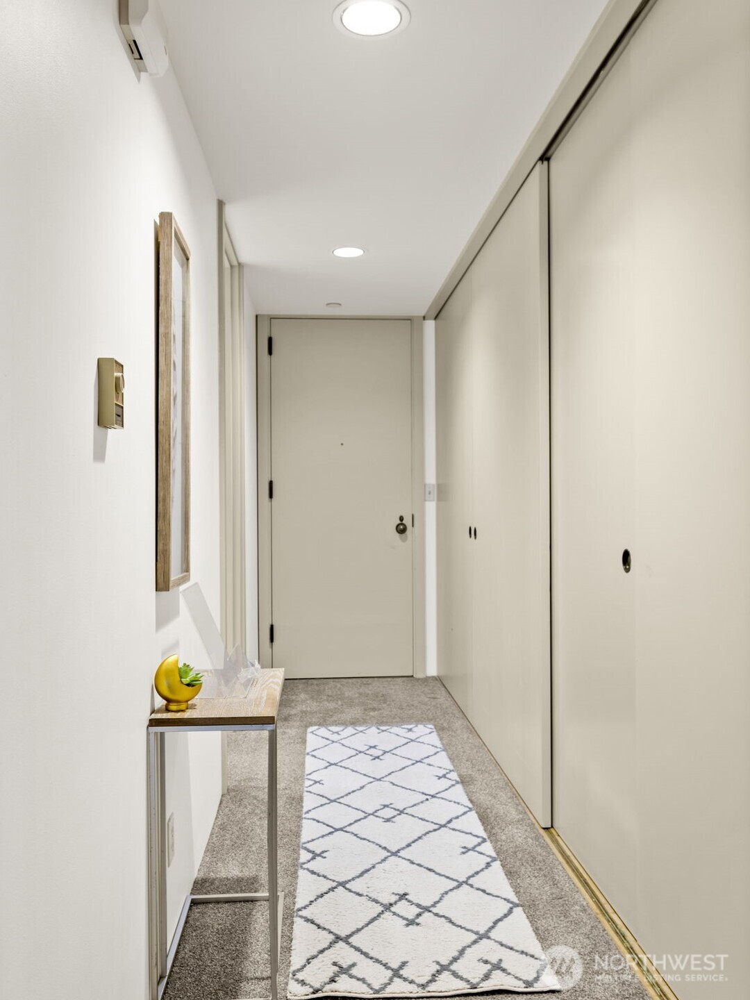 98 Union Street, Unit 610 Seattle, WA 98101 - Photo 27 of 33 a view of room with wooden floor and window
