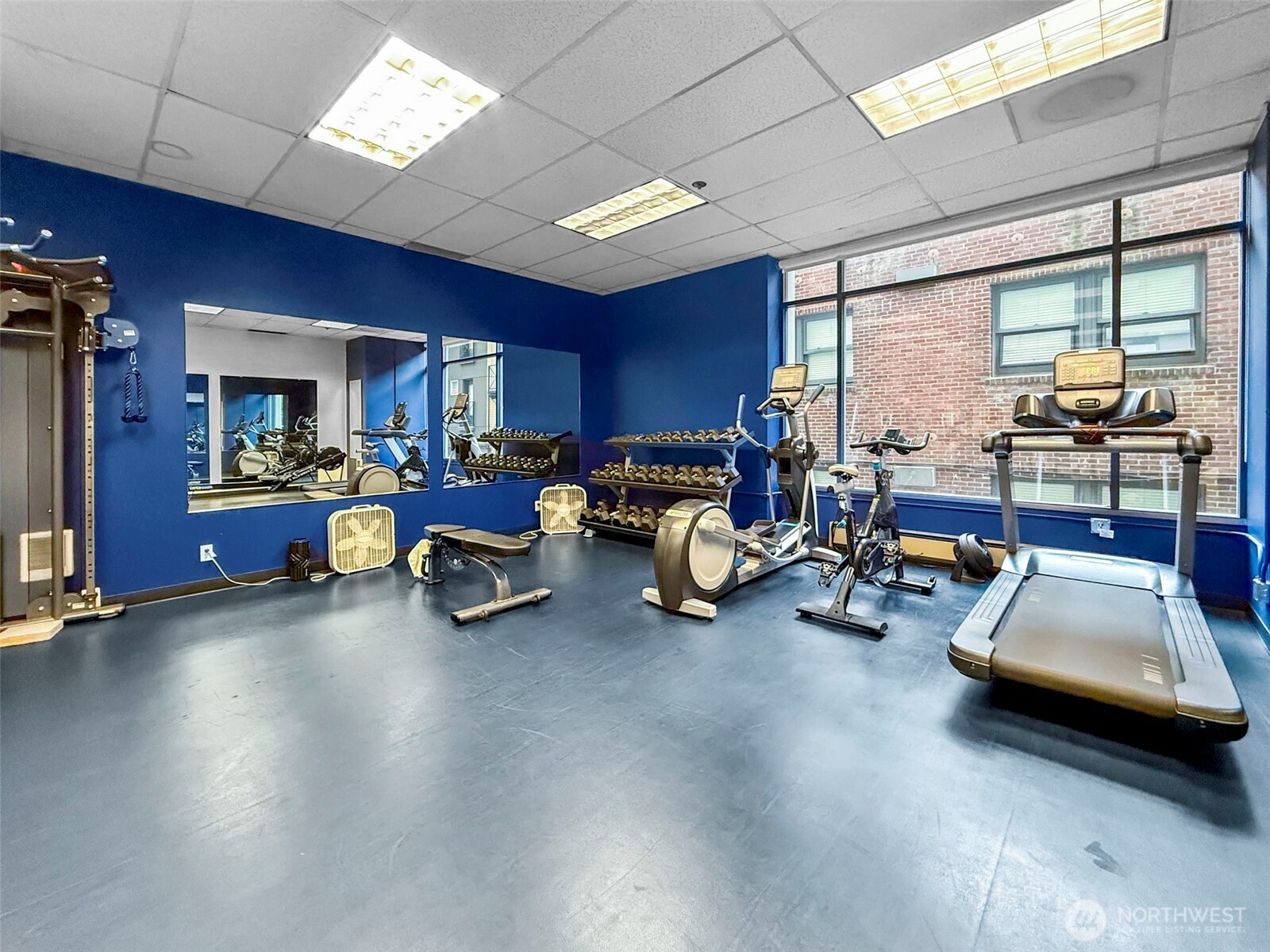 98 Union Street, Unit 610 Seattle, WA 98101 - Photo 30 of 33 a view of a livingroom with furniture window and a kitchen