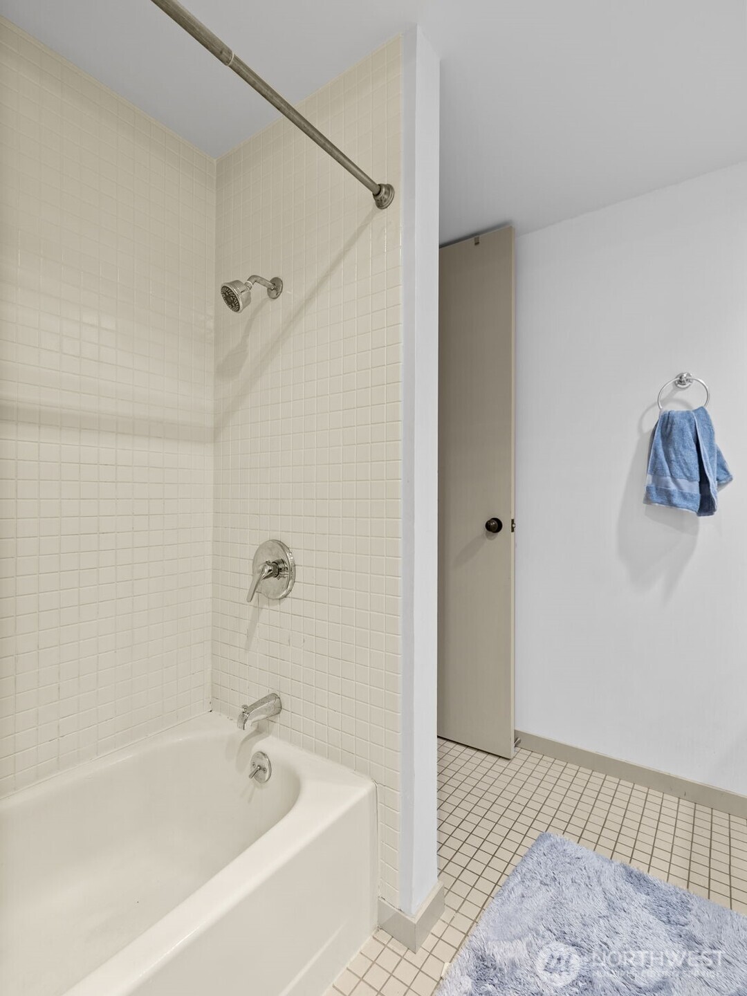 98 Union Street, Unit 610 Seattle, WA 98101 - Photo 9 of 33 a bathroom with a bathtub and a shower
