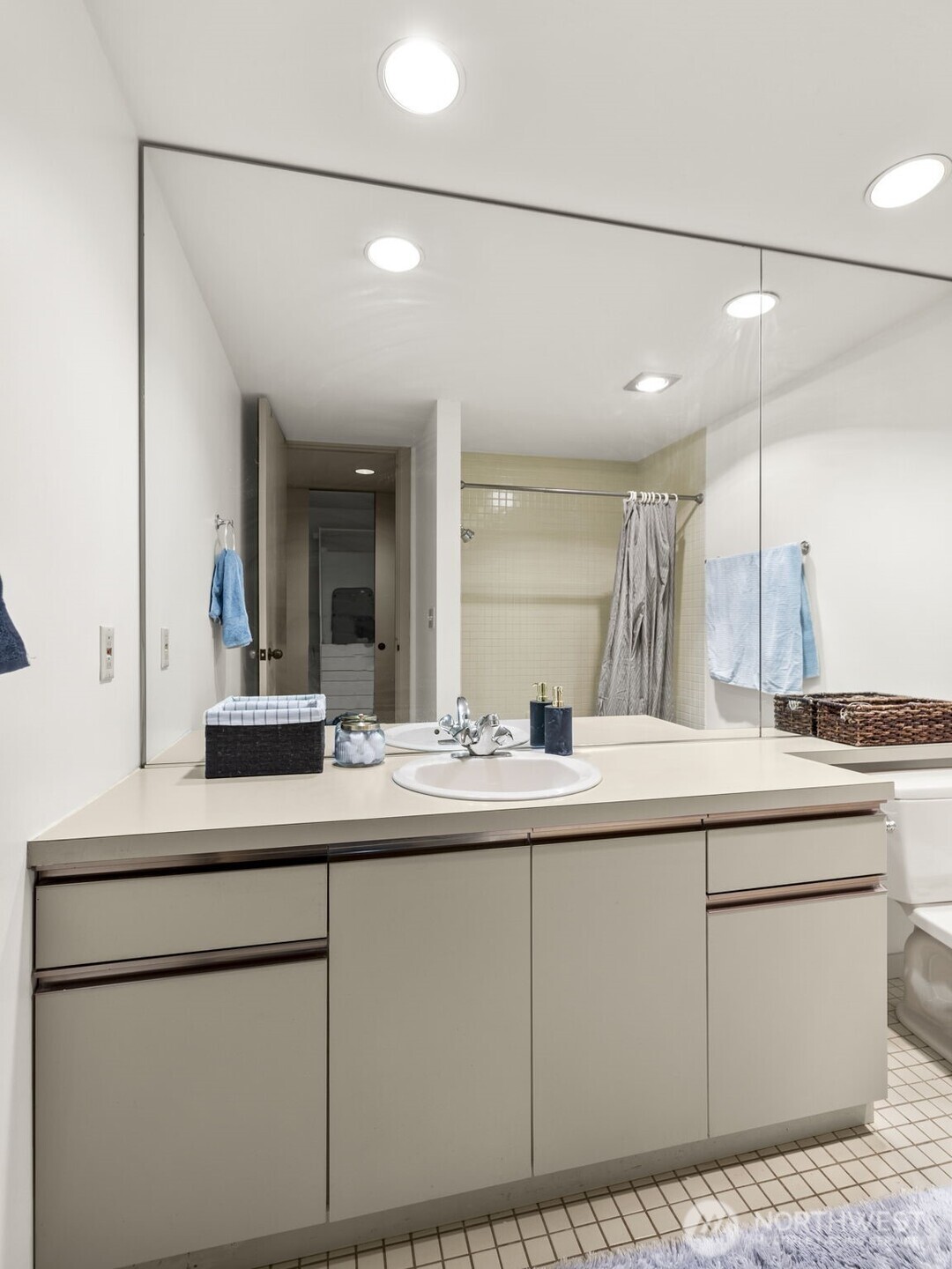 98 Union Street, Unit 610 Seattle, WA 98101 - Photo 10 of 33 a kitchen with sink and white cabinets