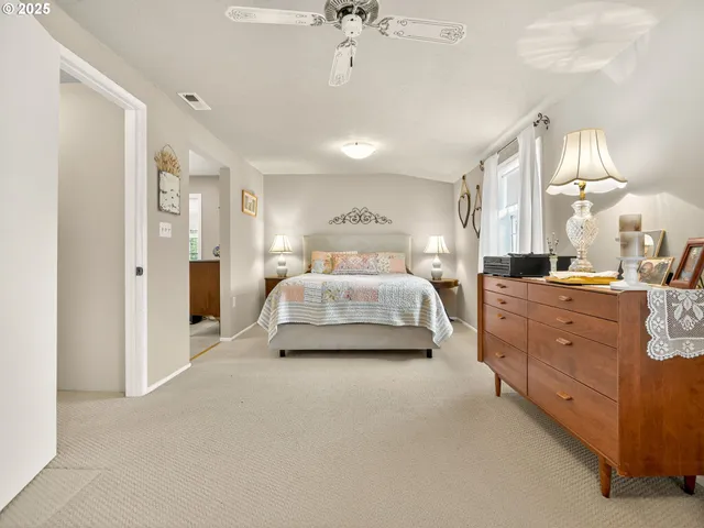 a room with a bed and a chandelier