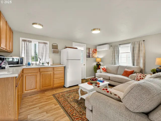 a kitchen with stainless steel appliances granite countertop a refrigerator sink and cabinets