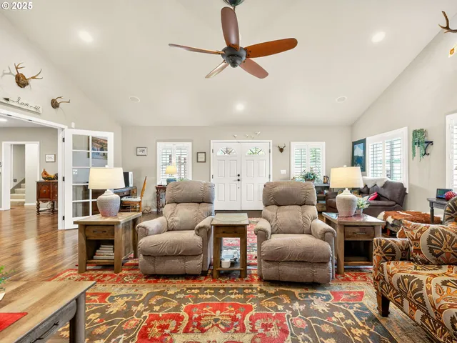 a living room with furniture and a rug