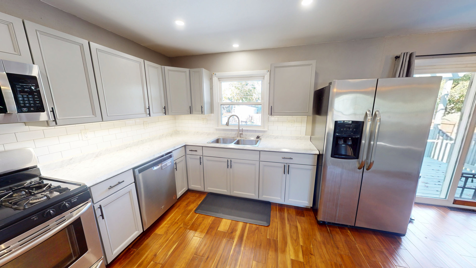 102 West Douglas Street St. Joseph, IL 61873 - Photo 18 of 27 a kitchen with a sink stove and refrigerator