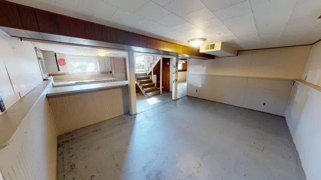 a kitchen with a sink stove and refrigerator