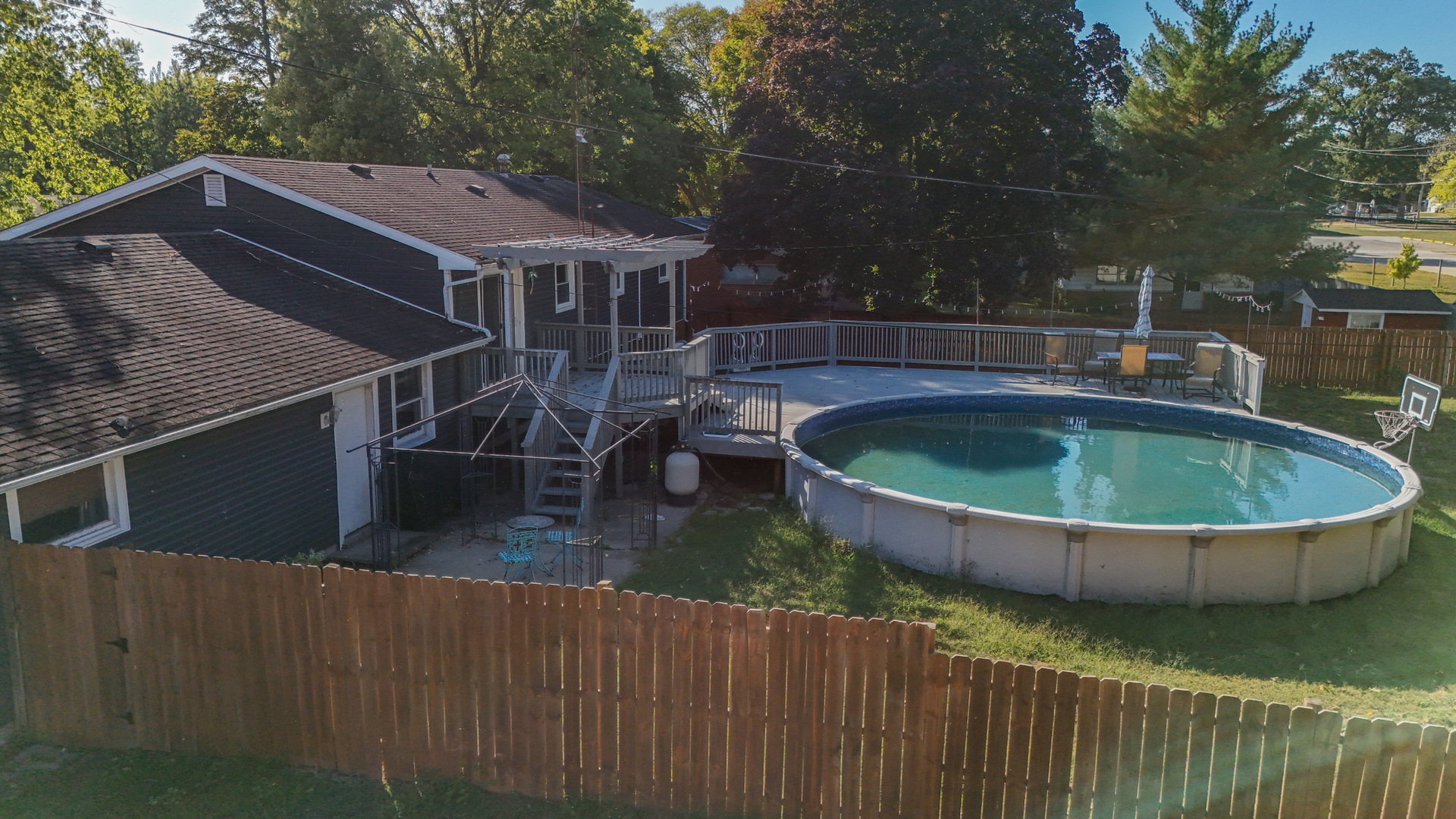 102 West Douglas Street St. Joseph, IL 61873 - Photo 4 of 27 a view of house with swimming pool and sitting area