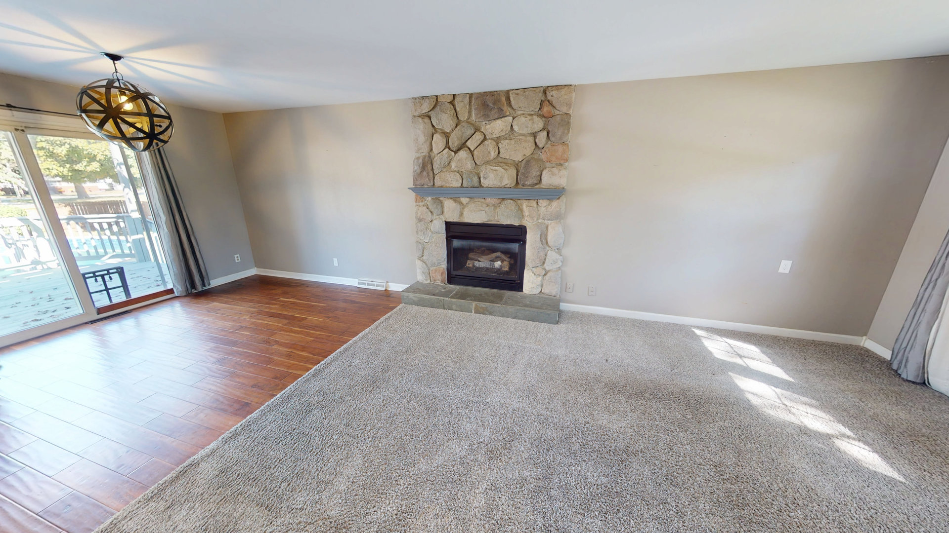 102 West Douglas Street St. Joseph, IL 61873 - Photo 10 of 27 a view of an empty room with a fireplace and a window
