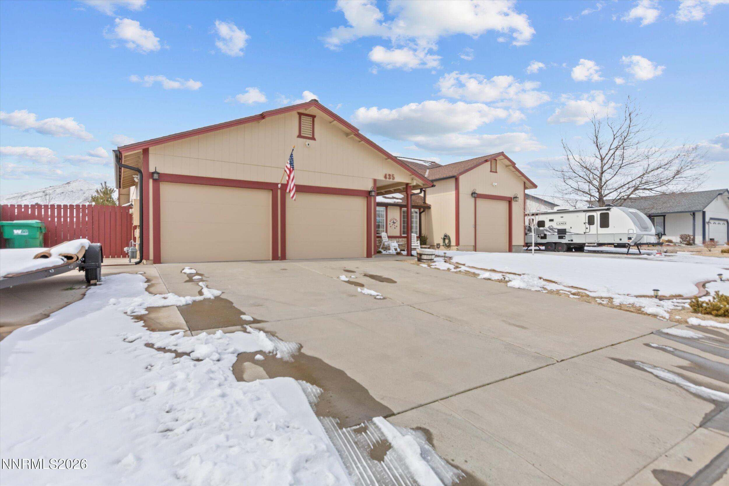 435 Kathy Terrace Sparks, NV 89436 - Photo 2 of 49 a front view of a house with a yard