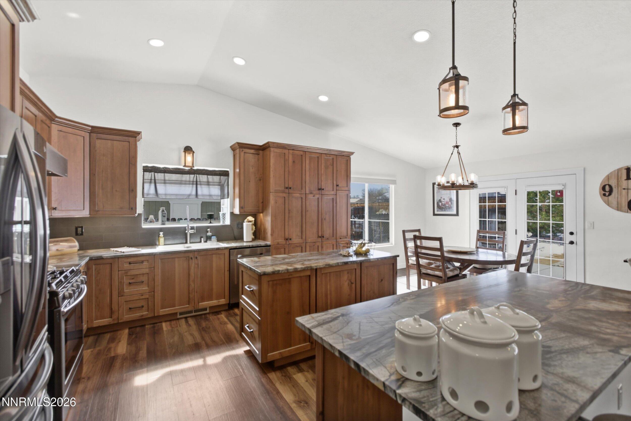 435 Kathy Terrace Sparks, NV 89436 - Photo 22 of 49 a large kitchen with a table and chairs