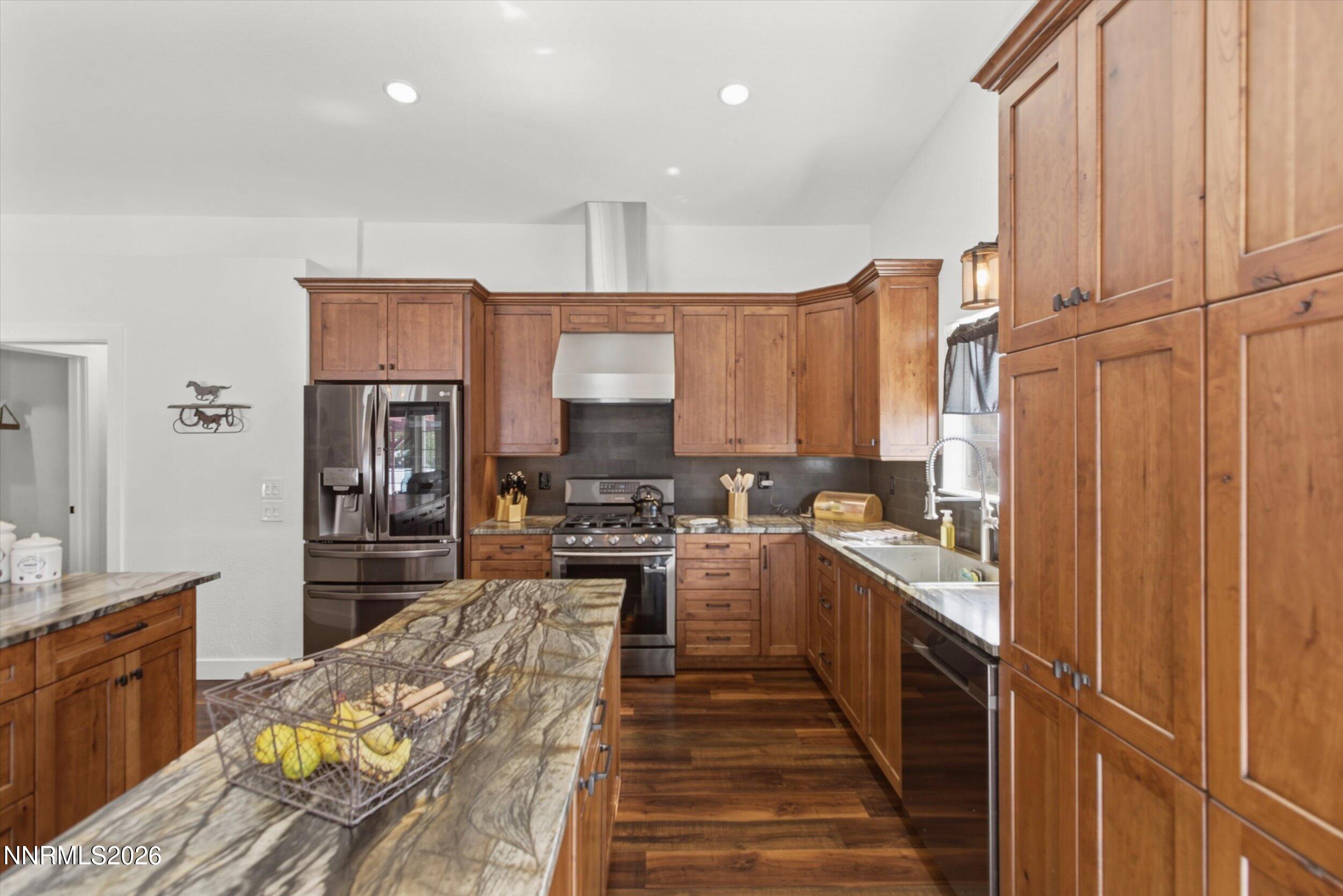 435 Kathy Terrace Sparks, NV 89436 - Photo 25 of 49 a kitchen with stainless steel appliances a sink stove and refrigerator