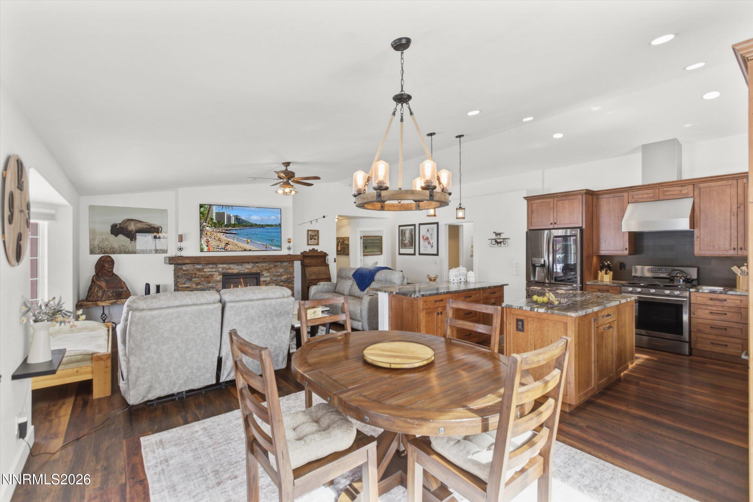 435 Kathy Terrace Sparks, NV 89436 - Photo 29 of 49 a view of a dining room with furniture a kitchen and chandelier