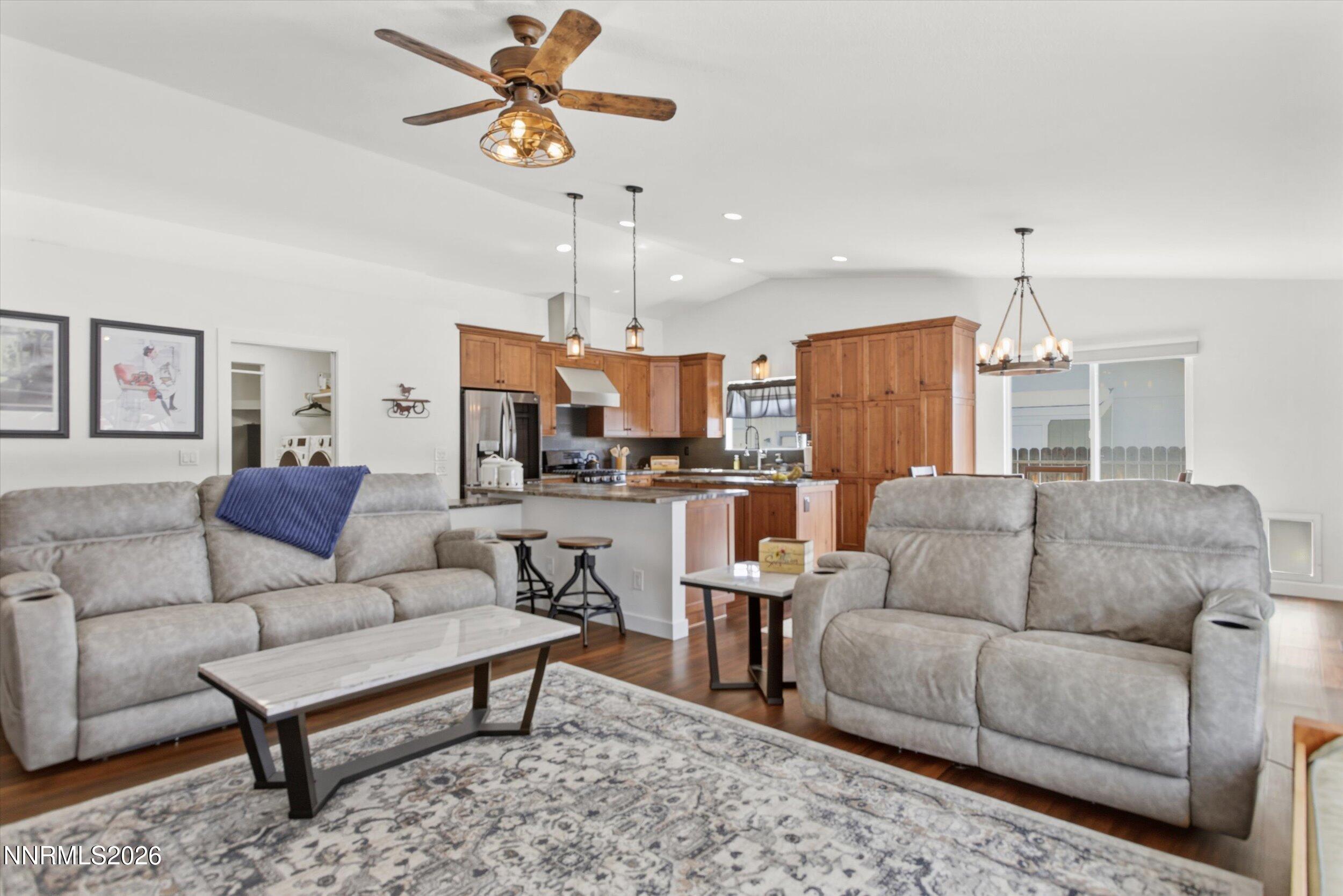 435 Kathy Terrace Sparks, NV 89436 - Photo 33 of 49 a living room with furniture kitchen view and a chandelier