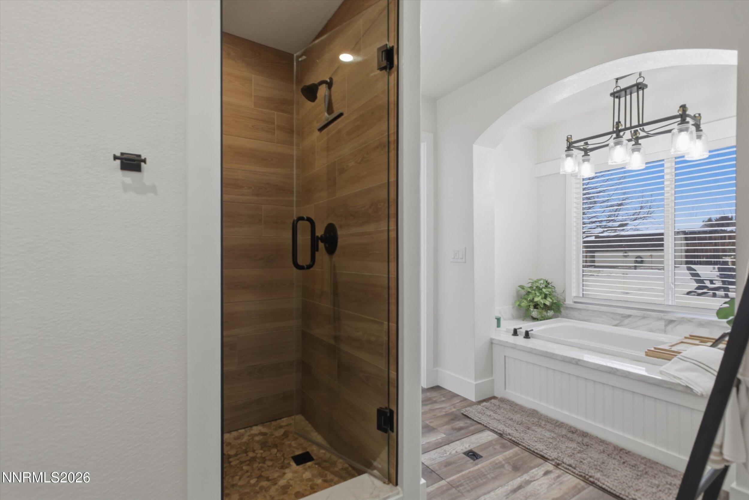 435 Kathy Terrace Sparks, NV 89436 - Photo 8 of 49 a bathroom with a bathtub and a shower