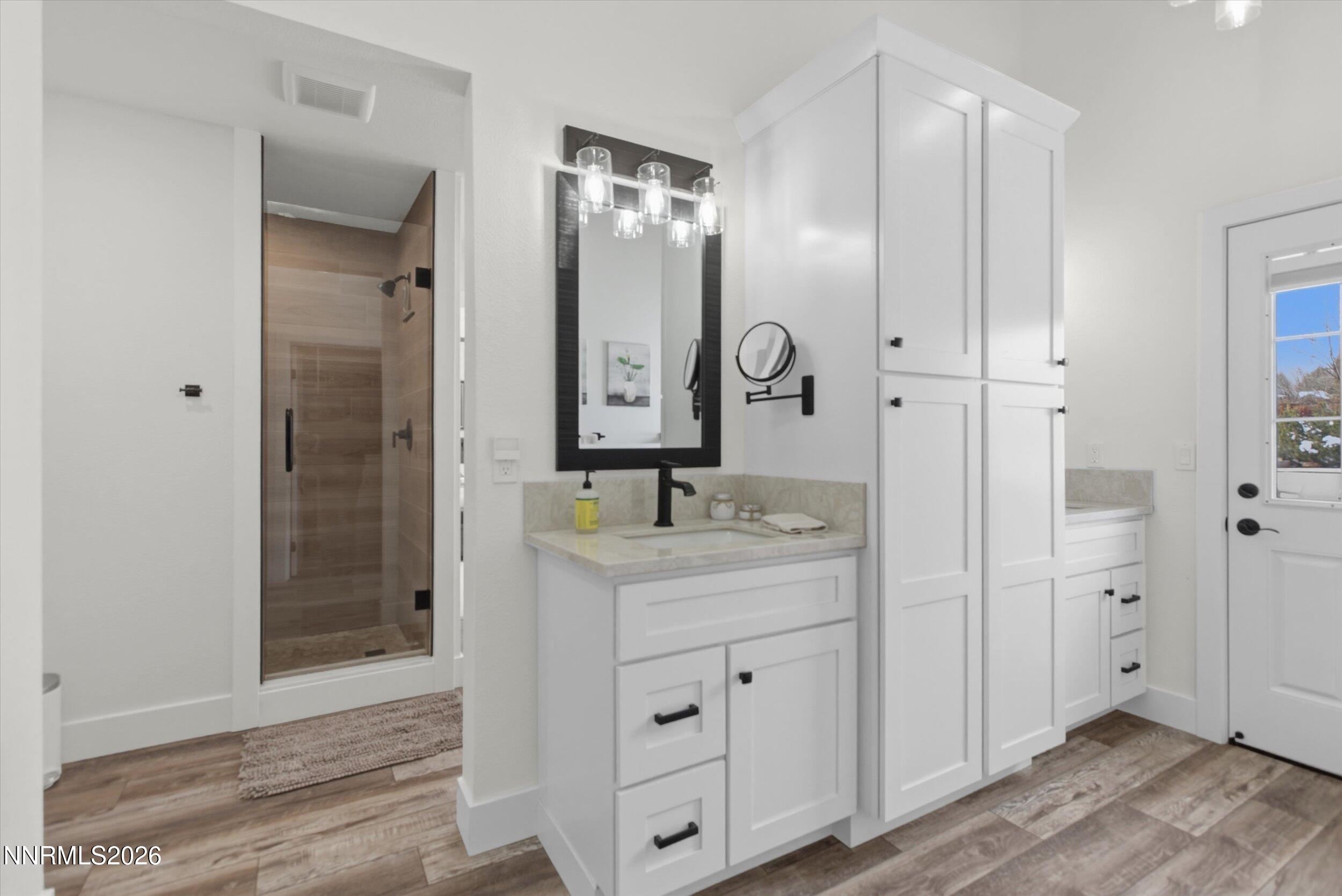 435 Kathy Terrace Sparks, NV 89436 - Photo 10 of 49 a bathroom with a granite countertop sink mirror and double