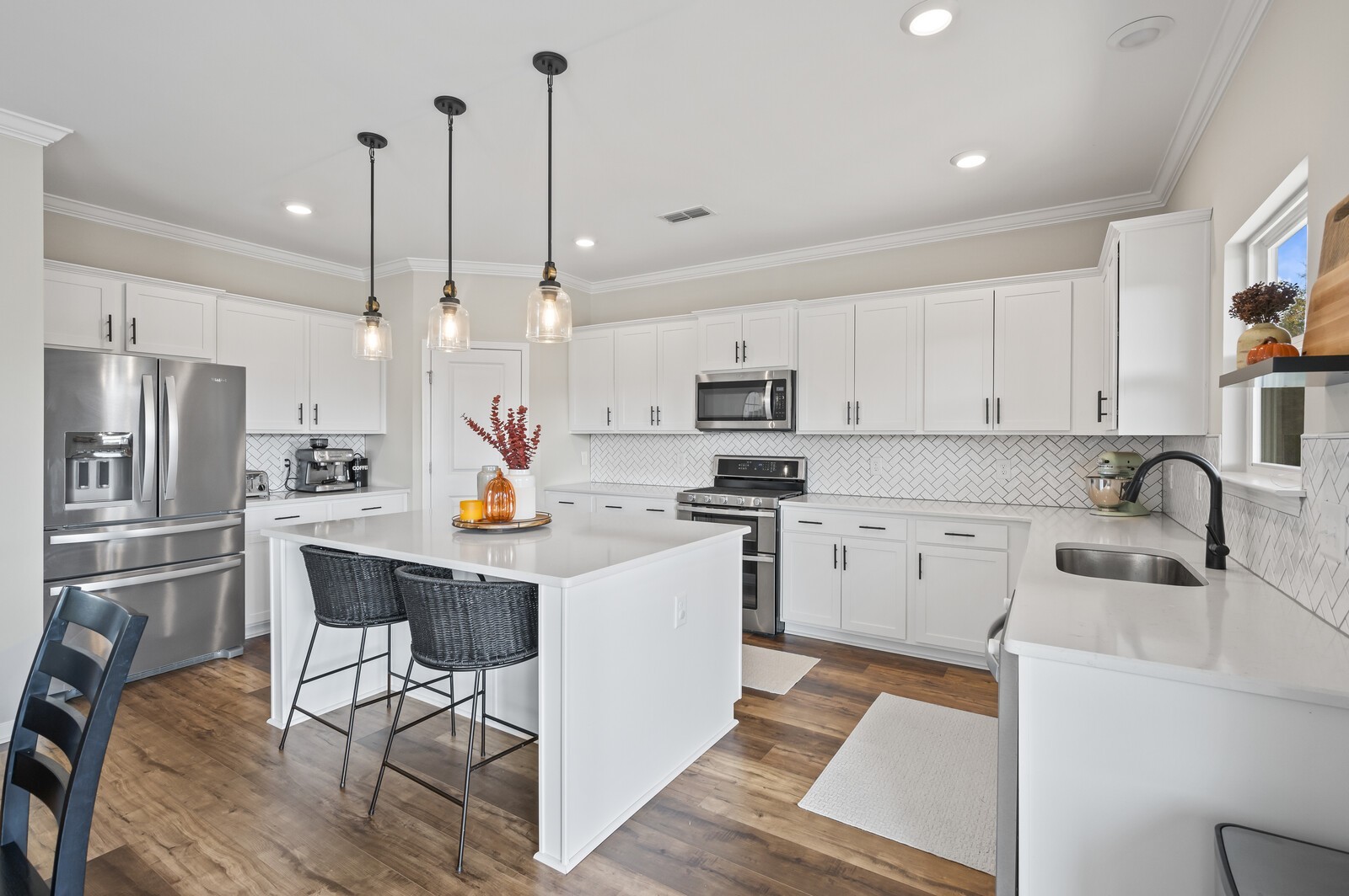 651 Castle Road Mount Juliet, TN 37122 - Photo 12 of 30 a kitchen with white cabinets and stainless steel appliances