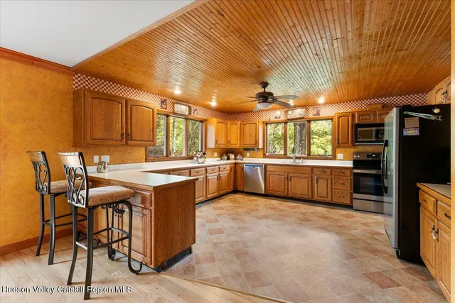 a kitchen with a sink cabinets and stainless steel appliances