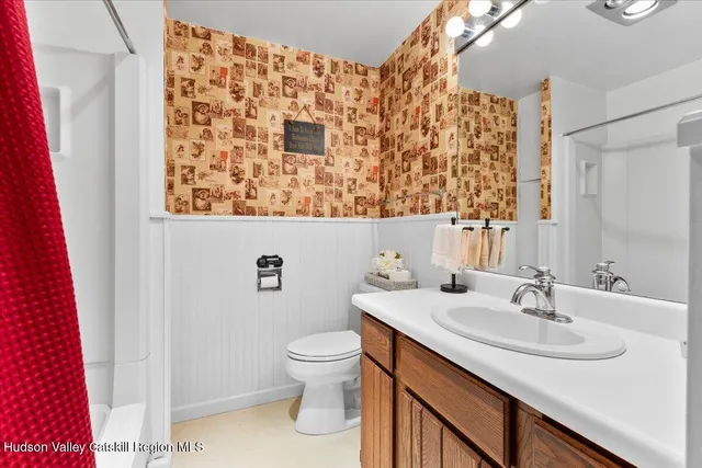 a bathroom with a sink and a toilet