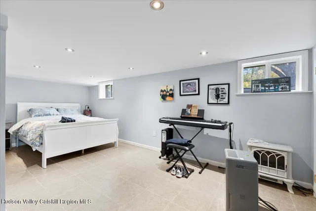 a bedroom with furniture and a window