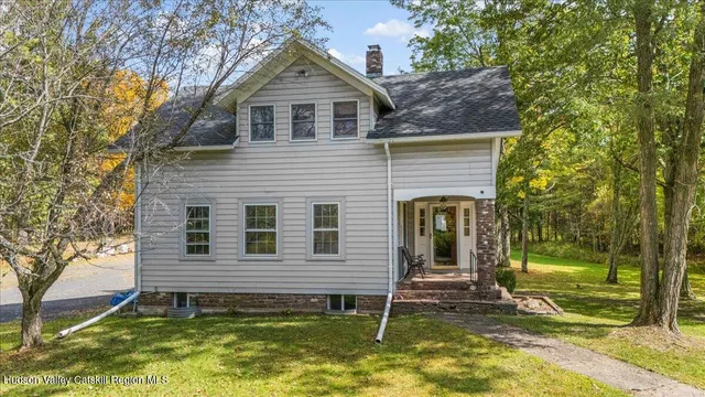 a view of a house with a yard