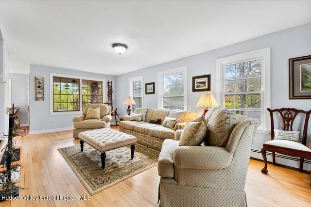 a living room with furniture and a window