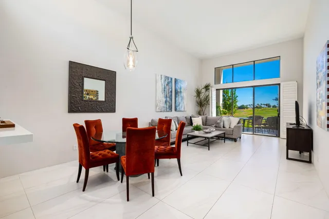 a view of a livingroom with furniture and a window