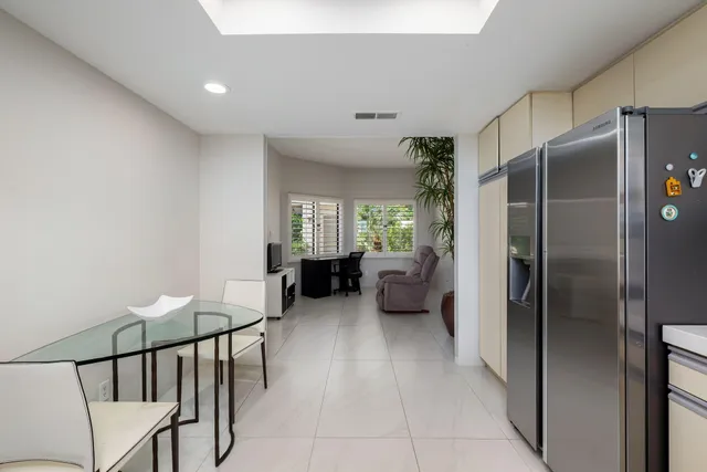 a view of a livingroom with furniture and windows