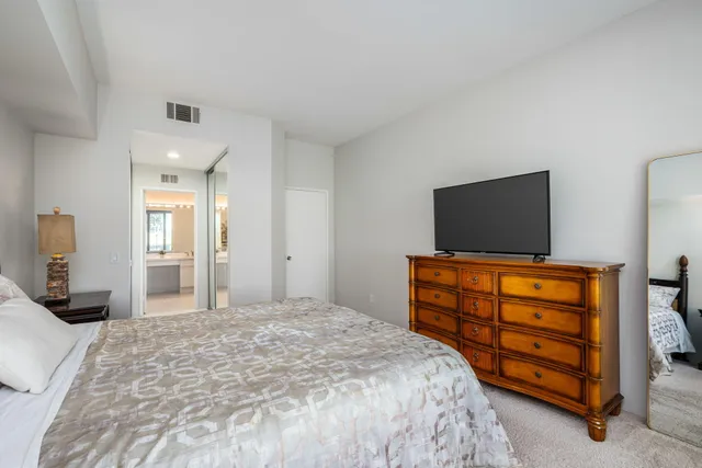 a bathroom with a double vanity sink mirror and double