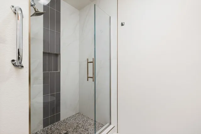 a bathroom with a sink toilet and a mirror