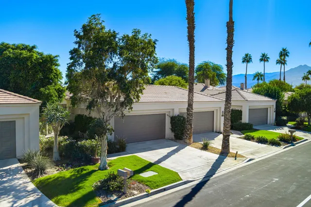 a view of balcony with a potted plant and outdoor seating