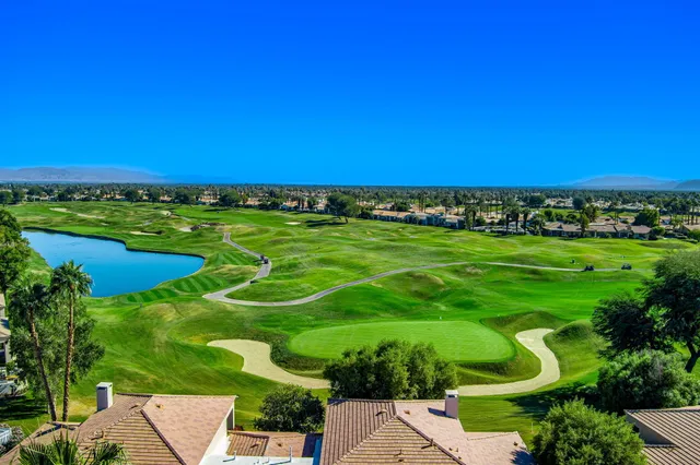 a view of a golf course with a lake