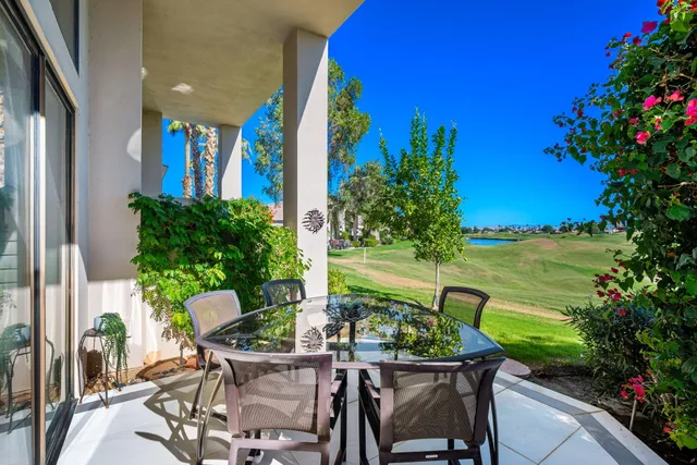 a view of a chairs and table in a patio